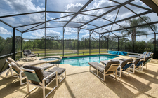 South-facing pool and spa with a lake and conservation view South-facing pool and spa with a lake and conservation view