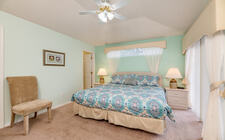 Master bedroom #1 with a king bed Master bedroom #1 with a king bed