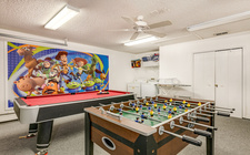 Game-room with pool table and foosball table Game-room with pool table and foosball table