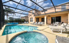 South-facing pool and spa with a lake and conservation view South-facing pool and spa with a lake and conservation view