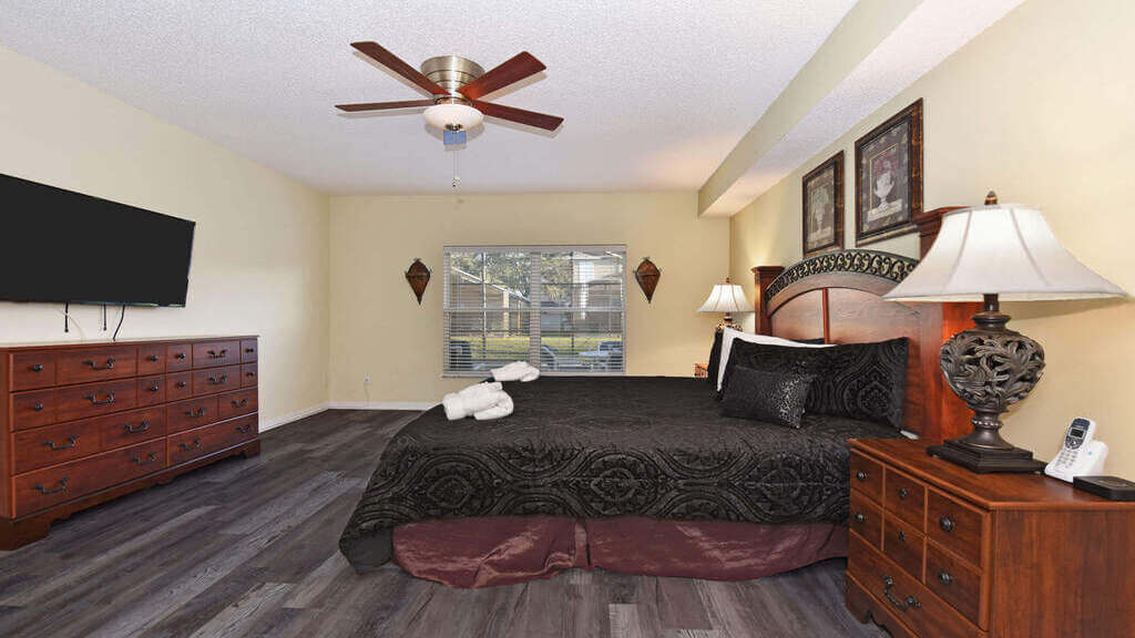 First floor master bedroom with a king size bed