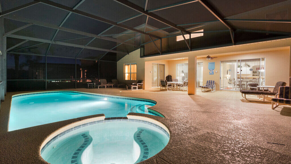 Night view of pool and spa