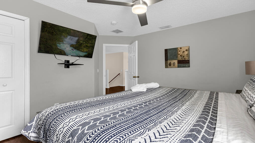 This bedroom has a closet and a flat-screen SMART TV!
