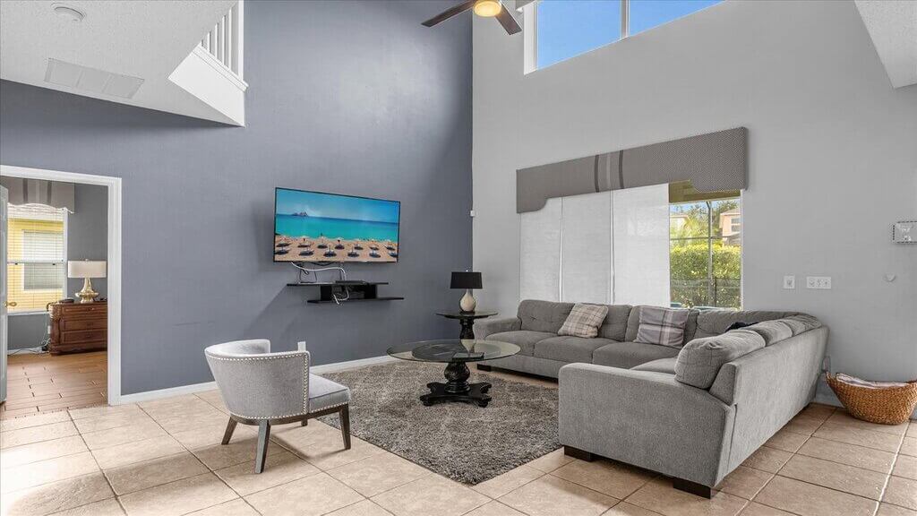 Family room has a 65" wall-mounted SMART TV