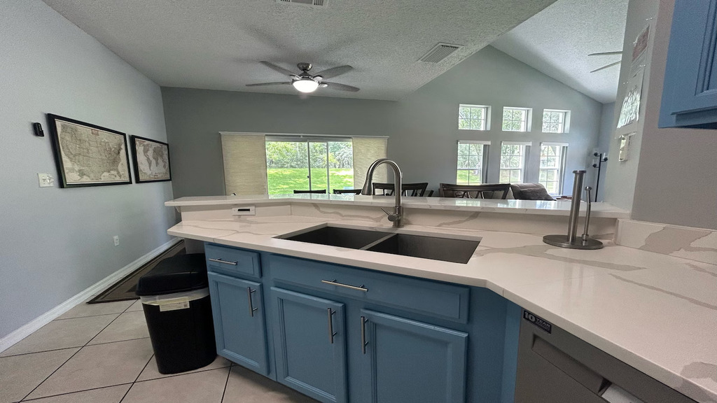 Full-size kitchen with all appliances, pots and pans