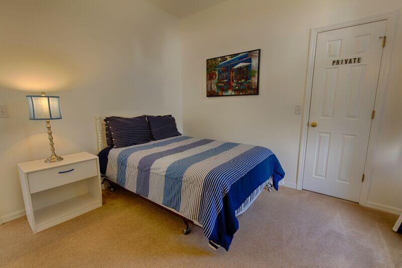 Bedroom #5 has a queen-size bed and a flat-screen TV