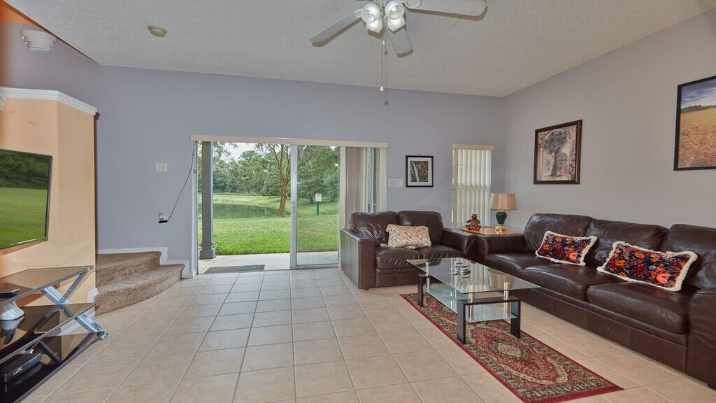 Living room, with comfy leather sofa and loveseat