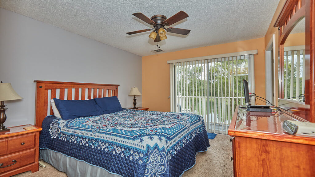 Master suite with queen bed and attached bathroom