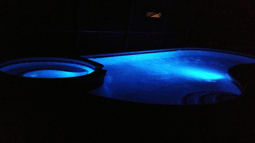 Pool at night with color changing lights