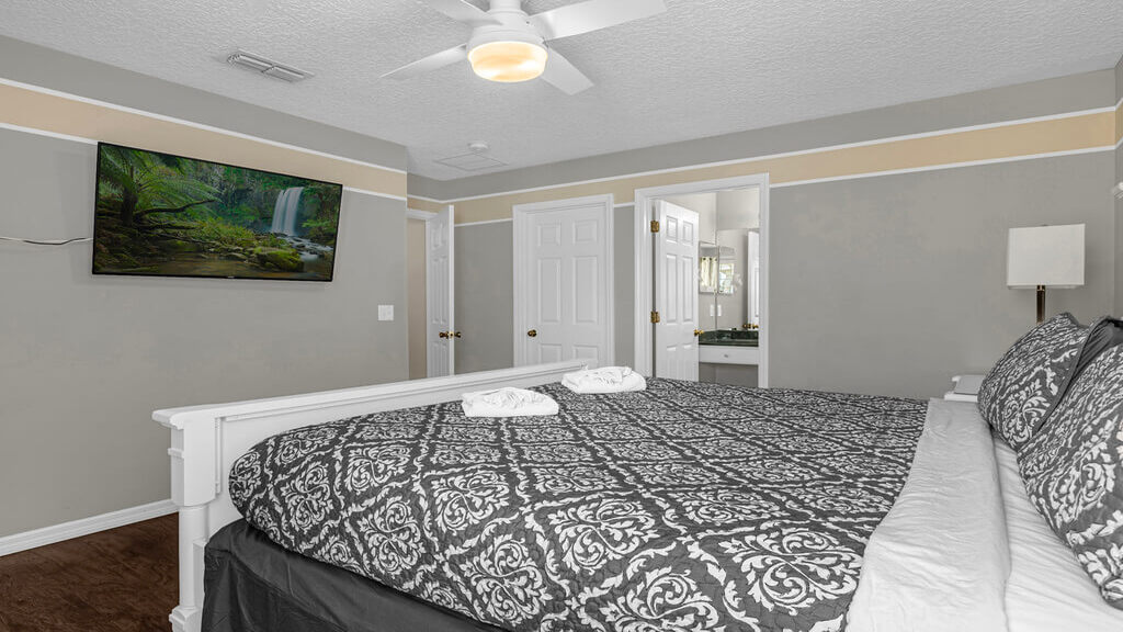 This bedroom has a walk-in closet, en-suite bathroom, and a 50" ROKU SMART TV