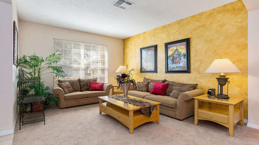 Spacious living area with sofa and love seat